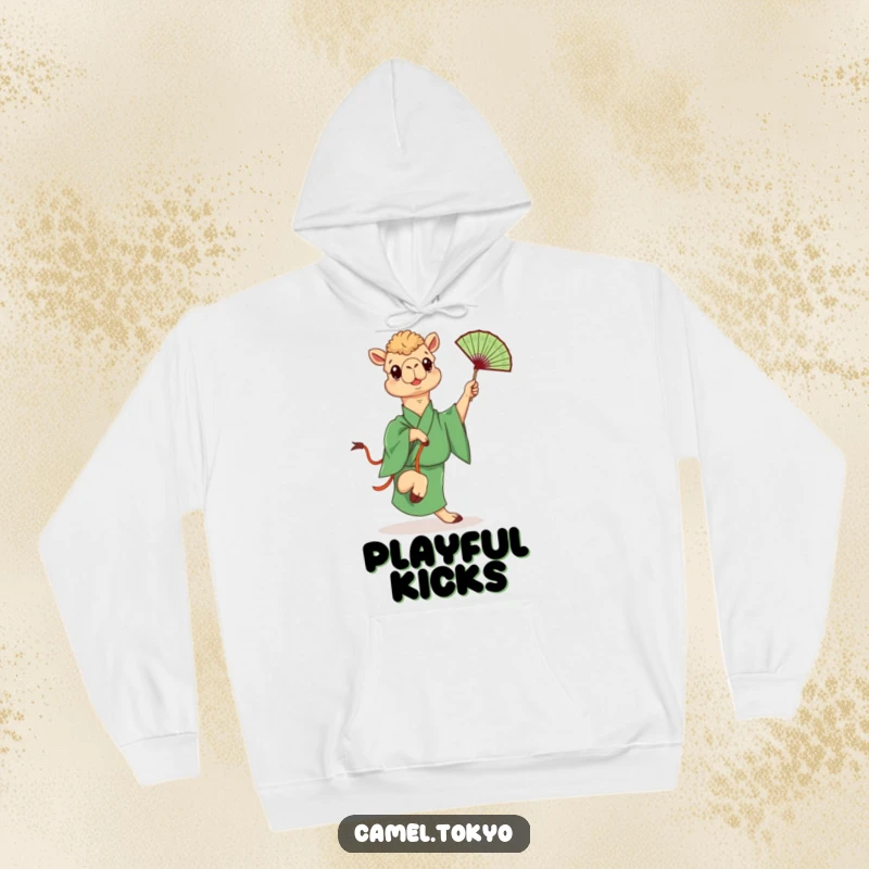 Funny hoodie showing a camel in a green kimono playfully kicking a fan, offering warm and humorous desert vibes.